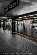 A subway train and platform beneath a 14 Street sign in New York. Photograph by Anders Jorulf.